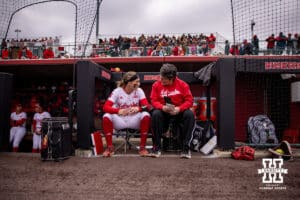 Nebraska Cornhusker Jordyn Bahl (98) talks with assistant coach Diane Miller before taking on the Indiana Hoosiers during a college softball game Friday, April 18, 2025 in Omaha, Nebraska. Photo by John S. Peterson.