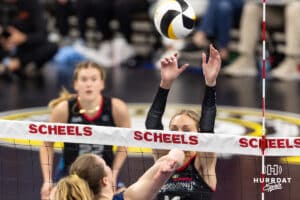 Omaha Supernova Ally Batenhorst (14) peeks over the net against the Grand Rapid Rise during the professional volleyball match Thursday, April 17, 2025 in Omaha, Nebraska. Photo by John S. Peterson.