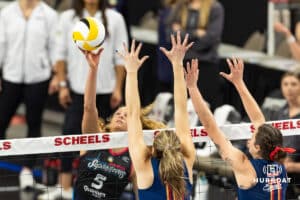 Omaha Supernova Brooke Nuneviller (5) tips the ball over Grand Rapid Rise Ali Bastianelli (10) and August Raskie the third set during the professional volleyball match Thursday, April 17, 2025 in Omaha, Nebraska. Photo by John S. Peterson.