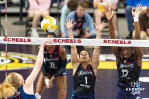 Omaha Supernova Natalia Valentin-Anderson (1) and Phoebe Awoleye jump up to block Grand Rapid Rise Carli Snyder (4) in the third st during the professional volleyball match Thursday, April 17, 2025 in Omaha, Nebraska. Photo by John S. Peterson.