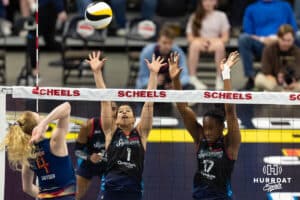 Omaha Supernova Natalia Valentin-Anderson (1) and Phoebe Awoleye (17) jump to block Grand Rapid Rise Carli Snyder (4) in the third set during the professional volleyball match Thursday, April 17, 2025 in Omaha, Nebraska. Photo by John S. Peterson.