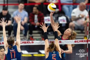 Omaha Supernova Brooke Nuneviller (5) hits the ball over the net against Grand Rapid Rise Alyssa Jensen (17) and Brooke Nuneviller inthe second set during the professional volleyball match Thursday, April 17, 2025 in Omaha, Nebraska. Photo by John S. Peterson.