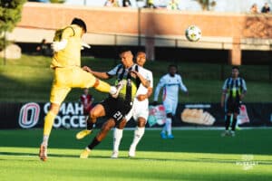 Union Omaha Aarón Gómez in a dangerous position with the goalkeeper of San Antionio FC during a soccer game at Caniglia Field on Tuesday, April 15, 2025, in Omaha, Nebraska. Photo by Collin Stilen.