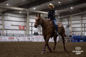 Lindsay Peterson heads back round up steers for the 13.5 Short Go event during the John Cook Roping Classic on Sunday, April 13, 2025 in Lincoln, Nebraska. Photo by John S. Peterson.