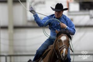 Cowboy ready to rope the steer's rear legs in a team roping competition during the John Cook Roping Classic on Sunday, April 13, 2025 in Lincoln, Nebraska. Photo by John S. Peterson.