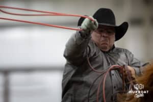 Cowboy throwing the rope to catch the legs in the team roping competition during the John Cook Roping Classic on Sunday, April 13, 2025 in Lincoln, Nebraska. Photo by John S. Peterson.