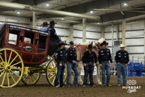 John Cook rode in to the arena for the main events in a stagecoach during the John Cook Roping Classic on Sunday, April 13, 2025 in Lincoln, Nebraska. Photo by John S. Peterson.