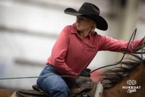 A cowgirl pulling the rope tight turning the steer for the healer in a team roping competition during the John Cook Roping Classic on Sunday, April 13, 2025 in Lincoln, Nebraska. Photo by John S. Peterson.