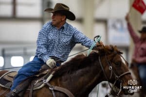 A cowboy roping a steer in a team roping competition during the John Cook Roping Classic on Sunday, April 13, 2025 in Lincoln, Nebraska. Photo by John S. Peterson.