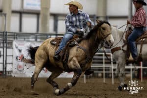 A cowboy pulling the rope tight on the steer during the John Cook Roping Classic on Sunday, April 13, 2025 in Lincoln, Nebraska. Photo by John S. Peterson.