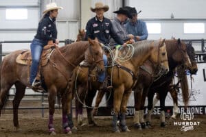 John Cook talking to Lindsay Peterson, director of operations for Nebraska volleyball, Lindsay is helping out around up the steers during the John Cook Roping Classic on Sunday, April 13, 2025 in Lincoln, Nebraska. Photo by John S. Peterson.