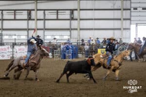 John Cook riding as the header on Rev with a the healer ready to rope the rear legs during the John Cook Roping Classic on Sunday, April 13, 2025 in Lincoln, Nebraska. Photo by John S. Peterson.
