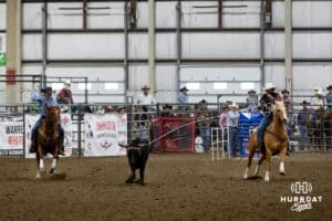 Taylor Cook, right, roped the steer by the horns as Jon Pudwill, left, prepares to throw the his rope to catch the heels during the John Cook Roping Classic on Sunday, April 13, 2025 in Lincoln, Nebraska. Photo by John S. Peterson.