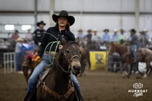 A cowgirl riding a horse gathering up her rope during the John Cook Roping Classic on Sunday, April 13, 2025 in Lincoln, Nebraska. Photo by John S. Peterson.