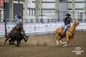 Taylor Cook riding as the header with a young ride healing at the John Cook Roping Clinic on Saturday, April 12, 2025 in Lincoln, Nebraska. Photo by John S. Peterson.