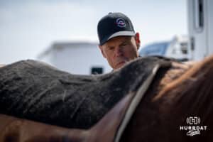 John Cook preparing Reggie for a saddle during the John Cook Roping Clinic on Saturday, April 12, 2025 in Lincoln, Nebraska. Photo by John S. Peterson.