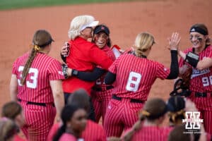 Nebraska Cornhusker Natalia Hill (27) receives a hug from head coach Rhonda Revelle after making a diving catch in center field against the Creighton Bluejays in the sixth inning during a college softball game Wednesday,April 4, 2025 in Lincoln, Nebraska. Photo by John S. Peterson.