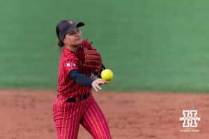 Nebraska Cornhusker Lauren Camenzind (2) throws to first for an out against the Creighton Bluejays in the 6th inning during a college softball game Wednesday,April 4, 2025 in Lincoln, Nebraska. Photo by John S. Peterson.