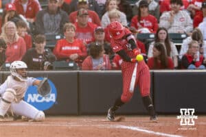 Nebraska Cornhusker Ava Kuszak (7) hits a solo home run against the Creighton Bluejays in the sixth inning during a college softball game Wednesday,April 4, 2025 in Lincoln, Nebraska. Photo by John S. Peterson.