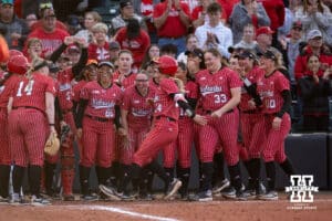 Nebraska Cornhusker Ava Bredwell (24) scores on a solo home run against the Creighton Bluejays in the 5th inning during a college softball game Wednesday,April 4, 2025 in Lincoln, Nebraska. Photo by John S. Peterson.