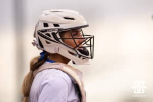 Creighton Bluejay catcher Lily West (8) looks to the coach for instructions against the Nebraska Cornhuskers in the first inning during a college softball game Wednesday,April 4, 2025 in Lincoln, Nebraska. Photo by John S. Peterson.