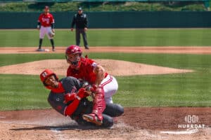 Nebraska Cornhusker catcher Will Jesske (13) tags out Rutgers Scarlet Knight Pablo Santos (6) Sunday, April 6, 2025, in Lincoln, Nebraska. Photo by Jansen Coburn.