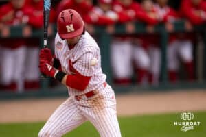 Nebraska Cornhusker infielder Dylan Carey (15) hit by a pitch in the eighth inning against the Creighton Bluejays during a college baseball game Tuesday, April 1, 2025 in Lincoln, Nebraska. Photo by John S. Peterson.