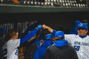 Creighton Bluejay Dakota Duffalo and Matthew Aukerman giving knuckles during a baseball game at Charles Schwab Field on April 8th, 2025 in Omaha Nebraska. Photo by Collin Stilen.