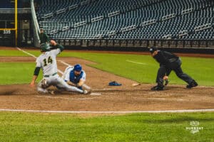 Creighton Bluejay Nate McHugh getting the out at the plate during a baseball game at Charles Schwab Field on April 8th, 2025 in Omaha Nebraska. Photo by Collin Stilen.