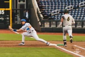 Creighton Bluejay Will MacLean getting the out at first base during a baseball game at Charles Schwab Field on April 8th, 2025 in Omaha Nebraska. Photo by Collin Stilen.