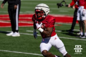 Nebraska Cornhuskers Emmett Johnson (21) runs with the ball during practice Tuesday, April 8, 2025 in Lincoln, Nebraska. Photo by John S. Peterson.