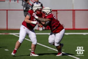 Nebraska Cornhuskers Jacob Brandl (78) and Preston Taumua (68) running drills during practice Tuesday, April 8, 2025 in Lincoln, Nebraska. Photo by John S. Peterson.