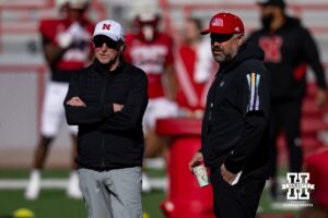 Nebraska Cornhusker coaches Dana Holgorsen and Matt Rhule talking during practice Tuesday, April 8, 2025 in Lincoln, Nebraska. Photo by John S. Peterson.