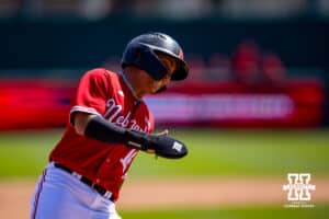 Nebraska Cornhusker infielder Devin Nunez (16) rounding third to score in the eighth inning against the Rutgers Scarlet Knights during a college baseball game Sunday, April 6, 2025 in Lincoln, Nebraska. Photo by John S. Peterson.