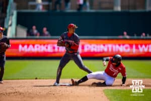 Nebraska Cornhusker utility Max Buettenback (11) out at second against Rutgers Scarlet Knight infielder Yomar Carreras (12) in the eighth inning during a college baseball game Sunday, April 6, 2025 in Lincoln, Nebraska. Photo by John S. Peterson.