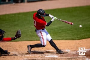 Nebraska Cornhusker utility Cayden Brumbaugh (0) gets a single in the seventh inning against the Rutgers Scarlet Knights during a college baseball game Sunday, April 6, 2025 in Lincoln, Nebraska. Photo by John S. Peterson.