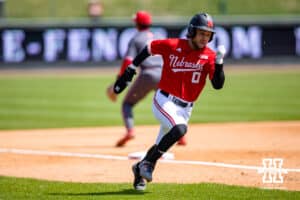 Nebraska Cornhusker utility Cayden Brumbaugh (0) runs home for a run against the Rutgers Scarlet Knights in the during a college baseball game Sunday, April 6, 2025 in Lincoln, Nebraska. Photo by John S. Peterson.