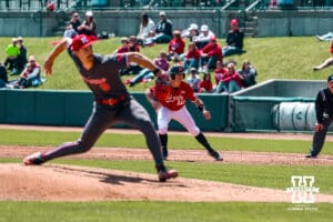 Nebraska Cornhusker outfielder Cael Frost (12) leads off of first base against the Rutgers Scarlet Knights during a college baseball game Sunday, April 6, 2025 in Lincoln, Nebraska. Photo by Jansen Coburn.