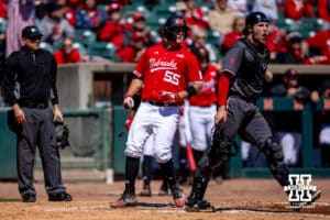 Nebraska Cornhusker infielder Tyler Stone (55) scores a run against the Rutgers Scarlet Knights in the fourth inning during a college baseball game Sunday, April 6, 2025 in Lincoln, Nebraska. Photo by John S. Peterson.