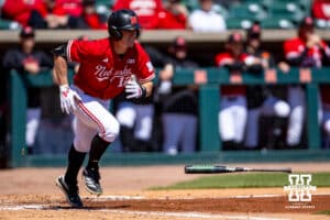 Nebraska Cornhusker outfielder Cael Frost (12) singles scoring Tyler Stone in the fourth innning against the Rutgers Scarlet Knights during a college baseball game Sunday, April 6, 2025 in Lincoln, Nebraska. Photo by John S. Peterson.