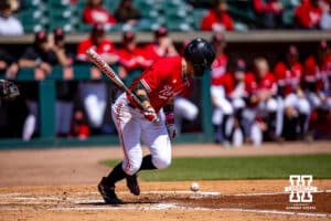 Nebraska Cornhusker outfielder Riley Silva (1) grounds out and Case Sanderson advances to second in the third inning during a college baseball game Sunday, April 6, 2025 in Lincoln, Nebraska. Photo by John S. Peterson.