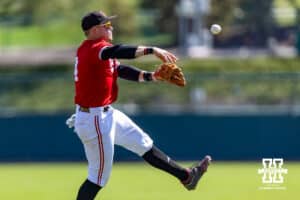 Nebraska Cornhusker infielder Josh Overbeek (4) throws to first against the Rutgers Scarlet Knights in the second inning during a college baseball game Sunday, April 6, 2025 in Lincoln, Nebraska. Photo by John S. Peterson.