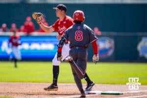 Nebraska Cornhusker utility Case Sanderson (14) makes a catch for an out against Rutgers Scarlet Knight outfielder Brennan Hyde (8) in the second inning during a college baseball game Sunday, April 6, 2025 in Lincoln, Nebraska. Photo by John S. Peterson.