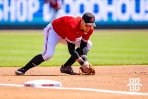 Nebraska Cornhusker infielder Josh Overbeek (4) scoops up the ball and throws to first for an out against the Rutgers Scarlet Knights in the second inning during a college baseball game Sunday, April 6, 2025 in Lincoln, Nebraska. Photo by John S. Peterson.