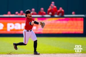Nebraska Cornhusker utility Cayden Brumbaugh (0) throws to first base for an out against the Rutgers Scarlet Knights in the first innning during a college baseball game Sunday, April 6, 2025 in Lincoln, Nebraska. Photo by John S. Peterson.