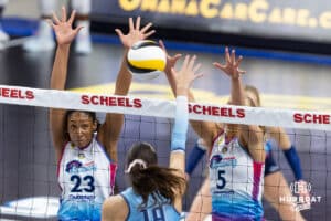 Omaha Supernovas Kaitlyn Hord (23) and Brooke Nuneviller (5) jump to block a shot from Orlando Valkyrie Lydia Grote (19) during a professional volleyball match Saturday, April 5, 2025 in Omaha, Nebraska. Photo by John S. Peterson.