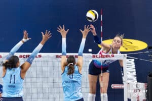 Omaha Supernovas Ally Batenhorst (14) spikes the ball against Orlando Valkyrie Kazmiere Bronw (11) and Brittany Abercrombie (6) during a professional volleyball match Saturday, April 5, 2025 in Omaha, Nebraska. Photo by John S. Peterson.