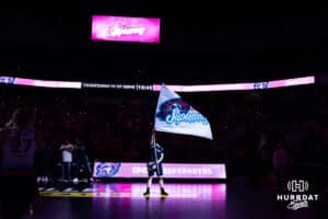 Omaha Supernovas Hype Squad member waves the Supernovas flag before taking on the Orlando Valkyries during a professional volleyball match Saturday, April 5, 2025 in Omaha, Nebraska. Photo by John S. Peterson.