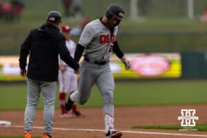 Oregon State Beaver infielder Jacob Krieg (22) gets five from third base coach after hitting a home run in the second inning against the Nebraska Cornhuskers during a college baseball game Saturday, March 29, 2025 in Lincoln, Nebraska. Photo by John S. Peterson.