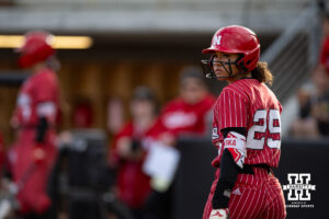 Nebraska Cornhusker Samentha Bland (29) looks back to coach Rhonda Revelease for her at bat against the Omaha Mavericks during a college softball game on Wednesday, March 26, 2025, in Omaha, Nebraska. Photo by John S. Peterson.